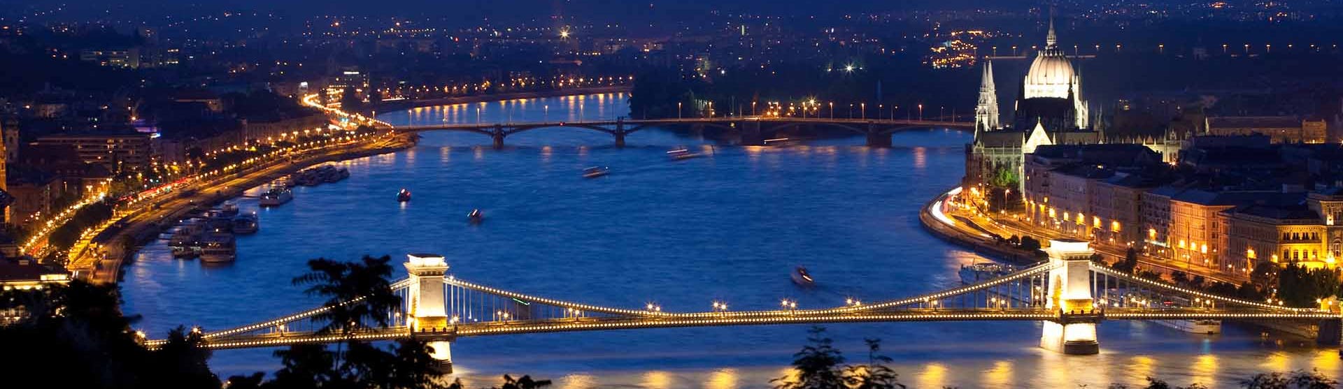 View of river Danube and Chain Bridge in Budapest shot during magic hour just after sunset.