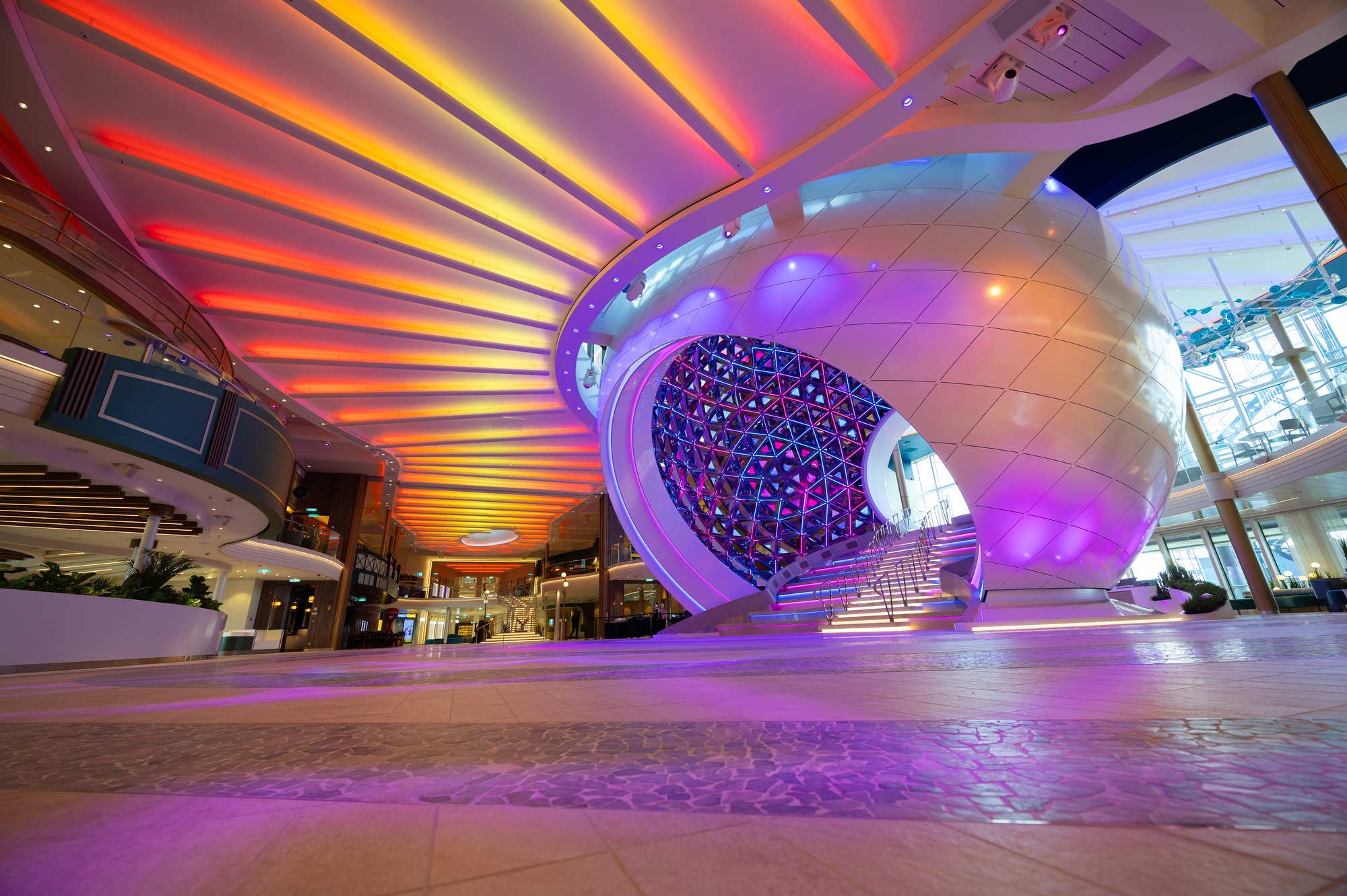 Colourful lights illuminate the promenade on board