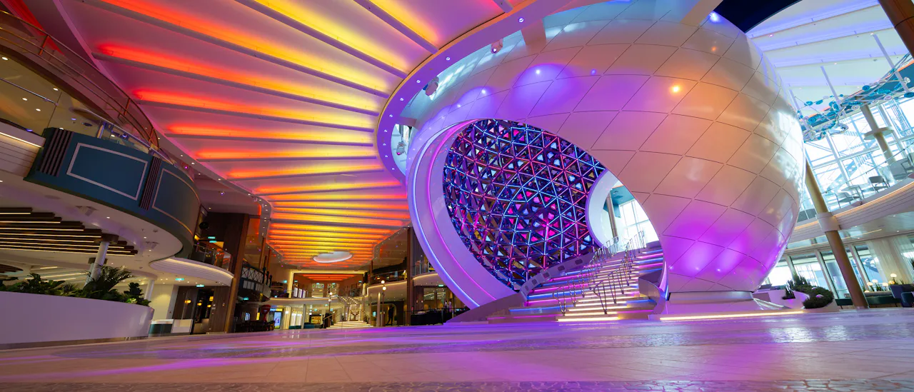 Colourful lights illuminate the promenade on board
