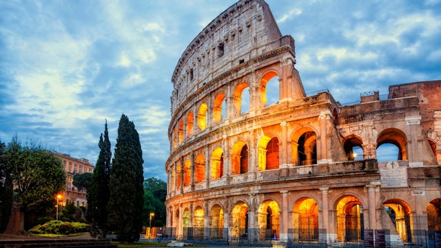 Colosseum morning in Rome, Italy. Exterior of the Rome Colosseum. Colosseum is one of the main attractions of Rome (Roma) and Italy. Architecture and landmark of Rome and Italy.