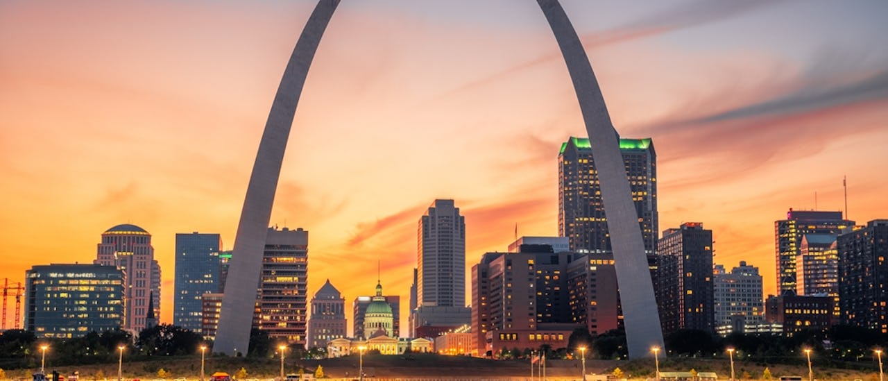 St. Louis, Missouri, USA downtown cityscape on the river at dusk.