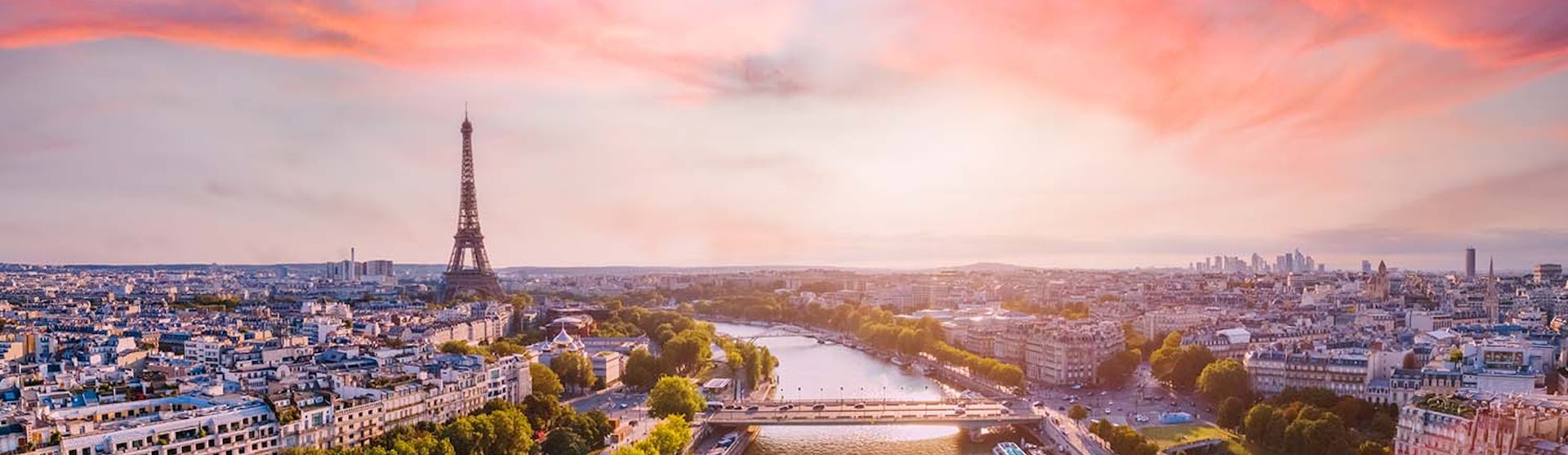 Paris aerial panorama with river Seine and Eiffel tower, France. Romantic summer holidays vacation destination. Panoramic view above historical Parisian buildings and landmarks with sunset sky