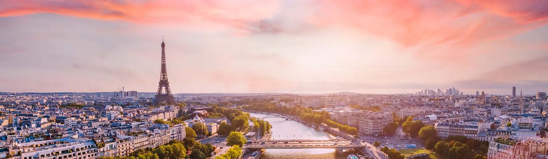 Paris aerial panorama with river Seine and Eiffel tower, France. Romantic summer holidays vacation destination. Panoramic view above historical Parisian buildings and landmarks with sunset sky