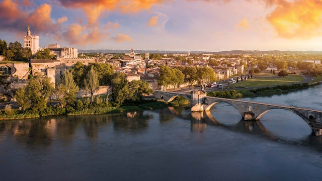 Beautiful view of Avignon with famous bridge Saint-Benezet, medieval architecture along the Rhone River in Avignon, France. The Pont Saint Benezet and the Papal palace in Avignon, South France.