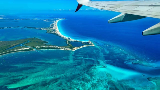 fly cruise Cancun as seen from an airplane window