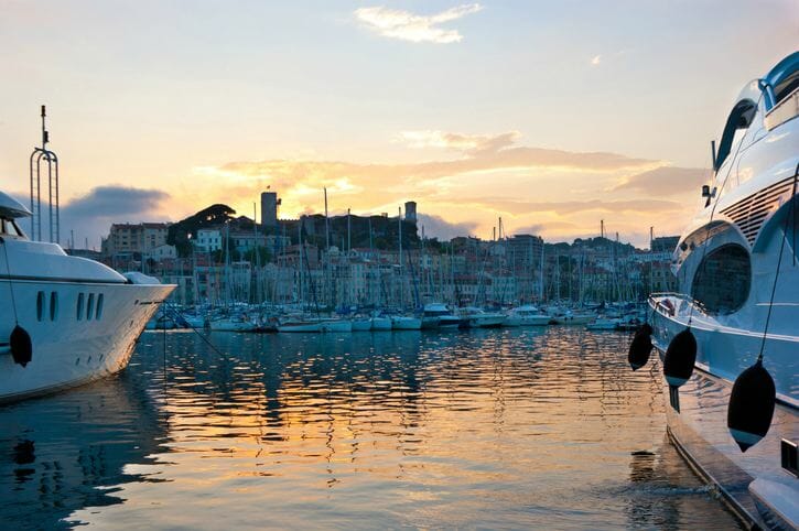 The old city between the yachts, Cannes, France.